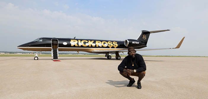 Rick Ross in front of his newly painted G550, which features the rapper's name in big gold letters