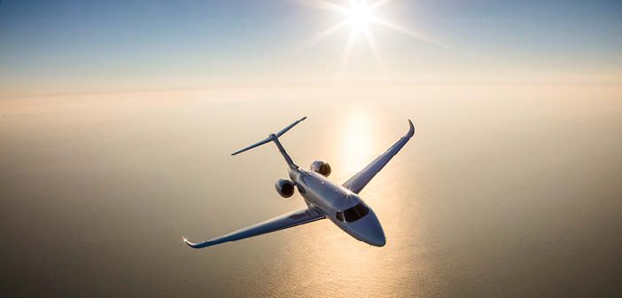 The Cessna Citation Longitude flying over water