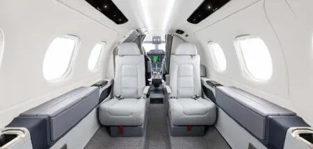 Business jet interior with view to cockpit