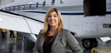 Meghan Knott in front of aircraft