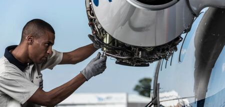 Man working on aircraft engine