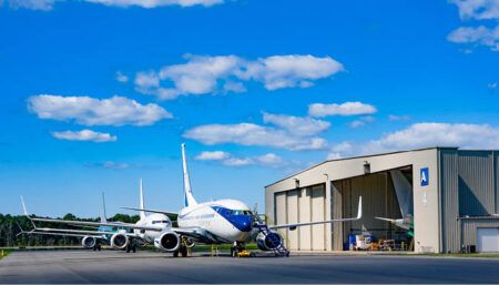 business jet outside hangar facility