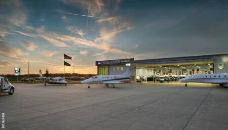 Business jets outside a hangar