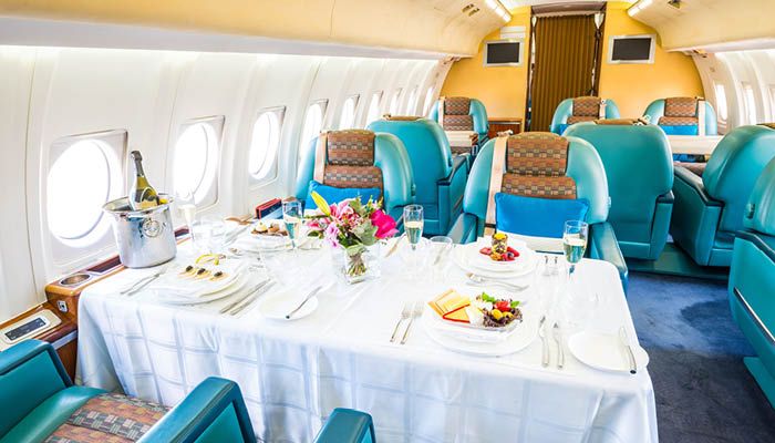 VIP aircraft cabin with table laid for dining