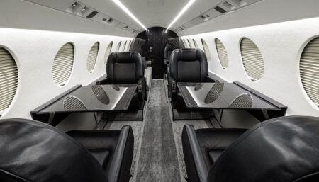 business jet interior with black leather seating
