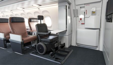 wheelchair on aircraft, in front of seat rows