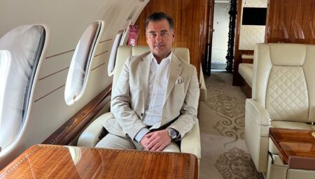 Michael Hoby Andersen seated in a business jet cabin