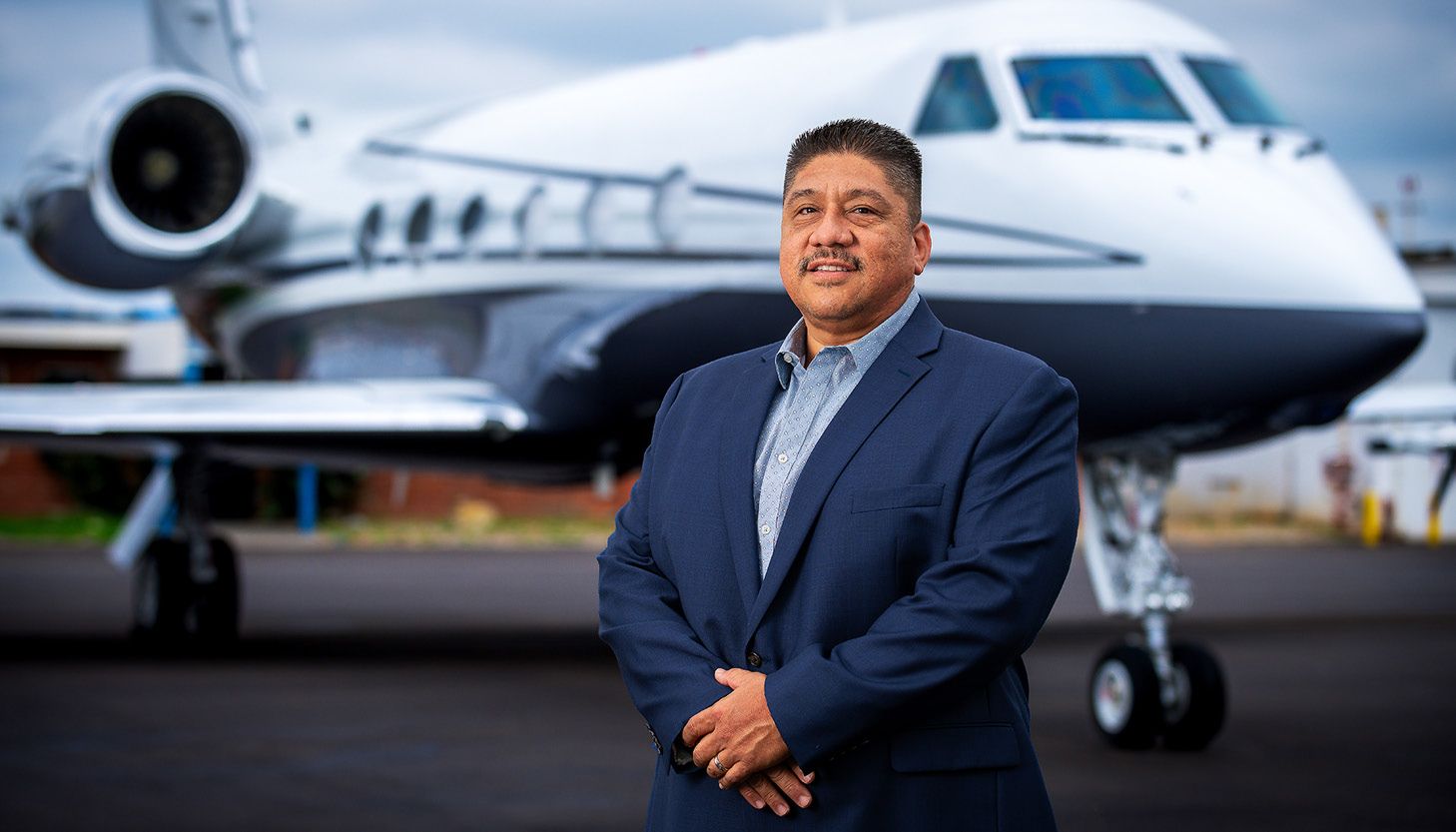 Edward Diaz with aircraft in background