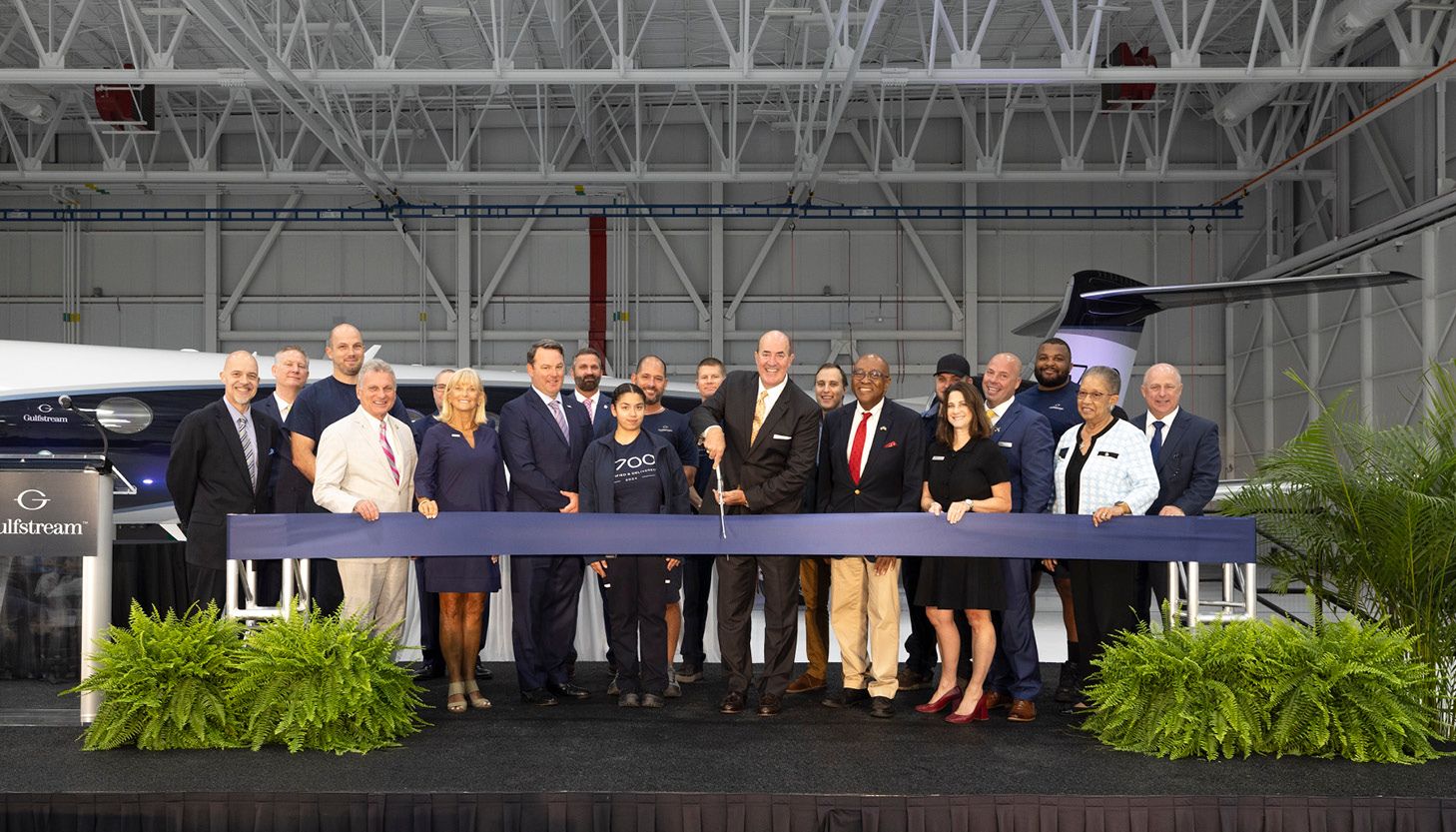 group of people at ribbon cutting