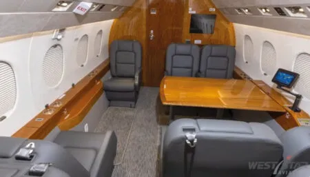 Falcon 2000 interior showing aft conference group and two club seats