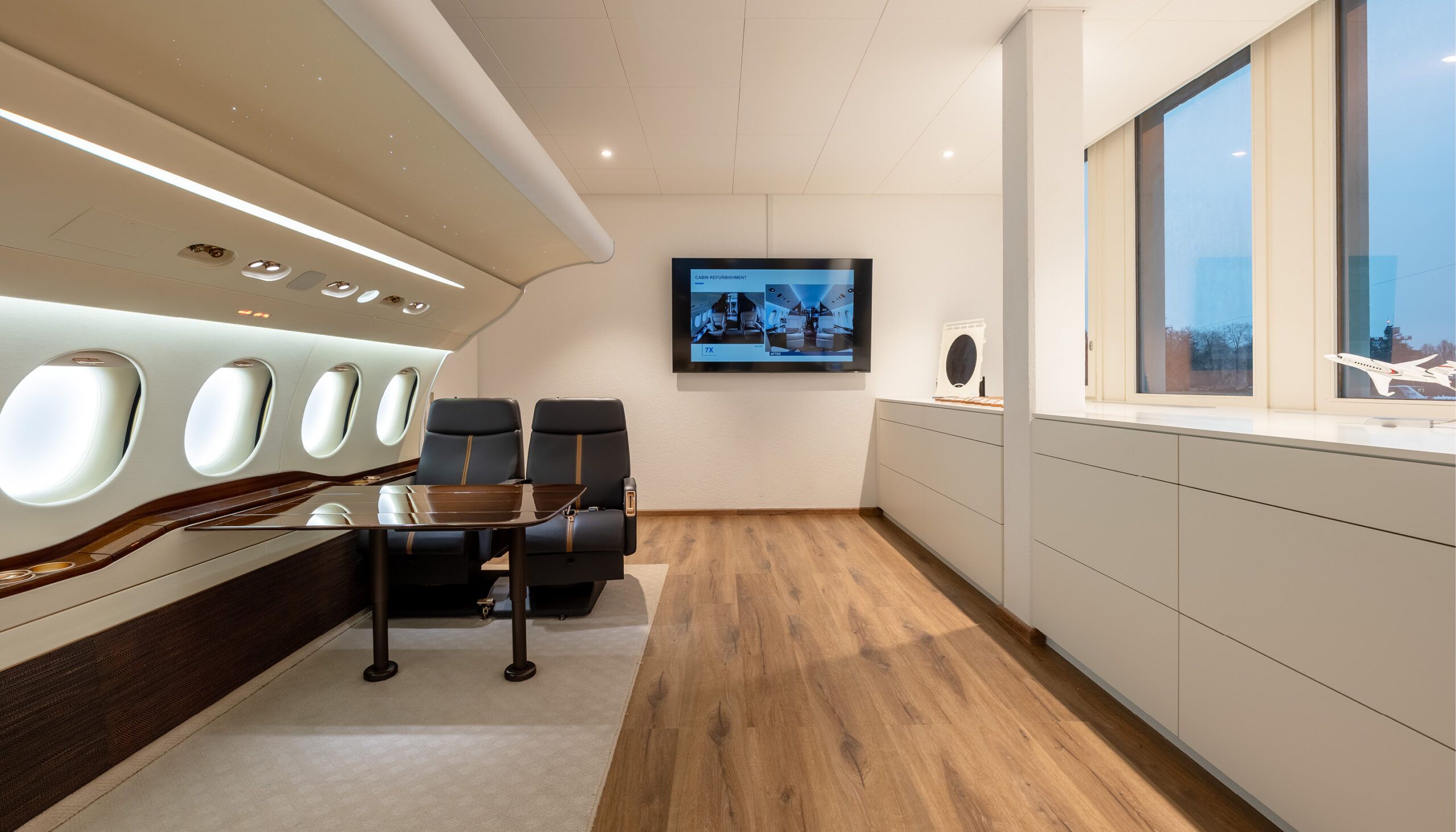 design showroom with two seats in a mockup of half a business jet cabin