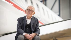 Elie Zelouf in front of aircraft