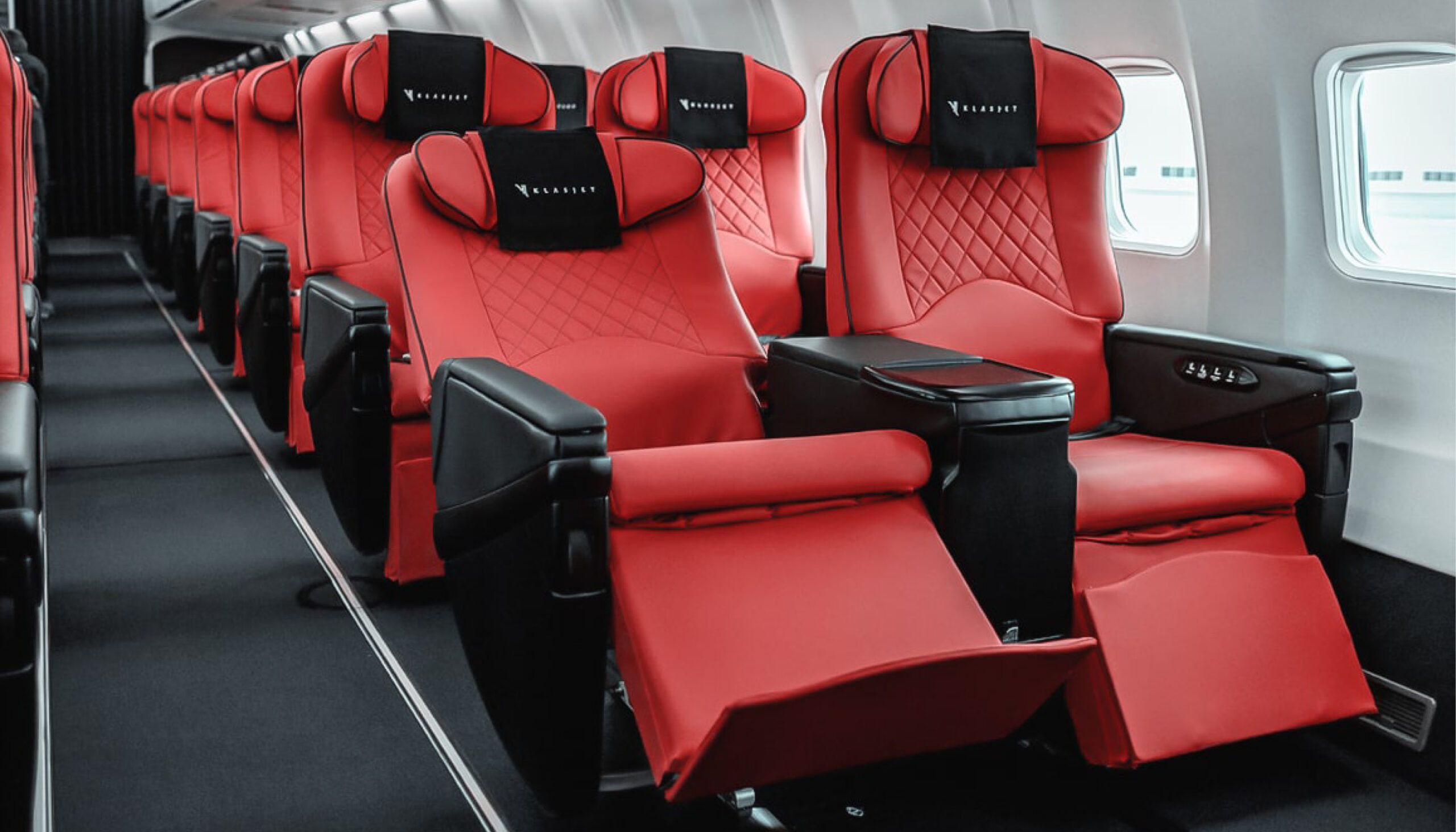 Boeing 737 interior with red and black seats