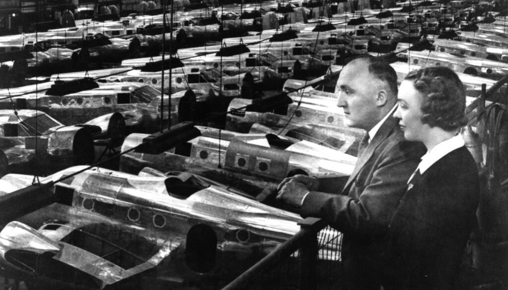 Walter and Olive Ann Beech looking out over an aircraft production line