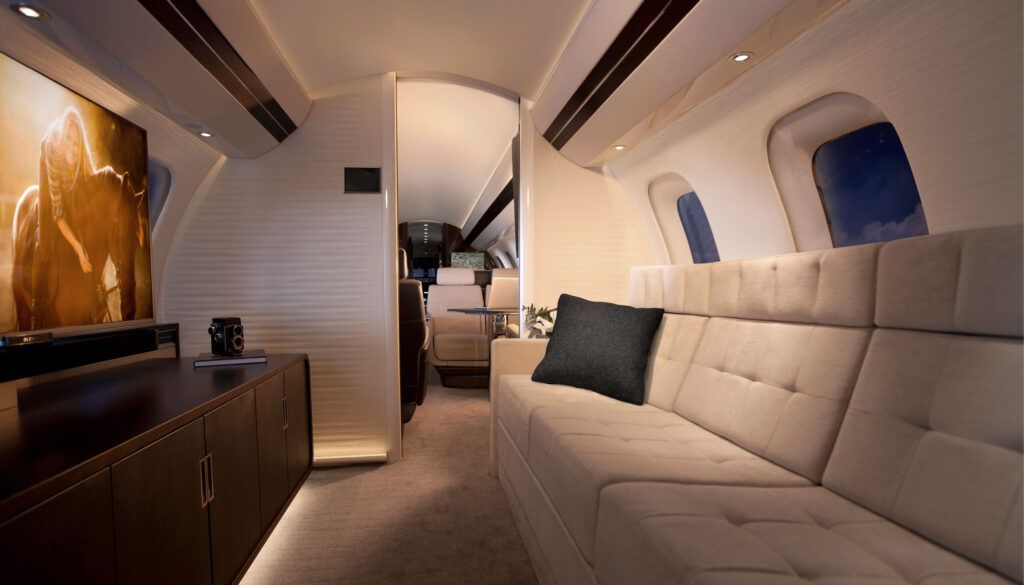 Bombardier Global 7500 Entertainment Suite - divan facing a credenza-mounted screen