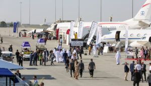 static display of business aircraft with lots of people walking around