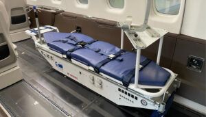 Air ambulance equipment including a stretcher in Pilatus PC-24 interior