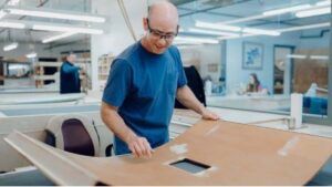 craftsperson working on panel