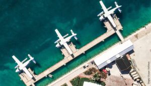 Overhead view of seaplanes at a harbour