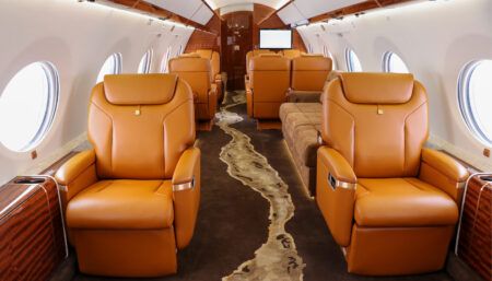 G650 with VIP seats in orange, and carpet with a flowing design