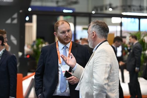 two people talking at tradeshow