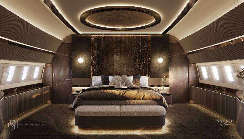 front-on view of king-size bed in luxury aircraft bedroom, featuring gold accents, underbed lighting, side lighting, overhead luminous circular feature