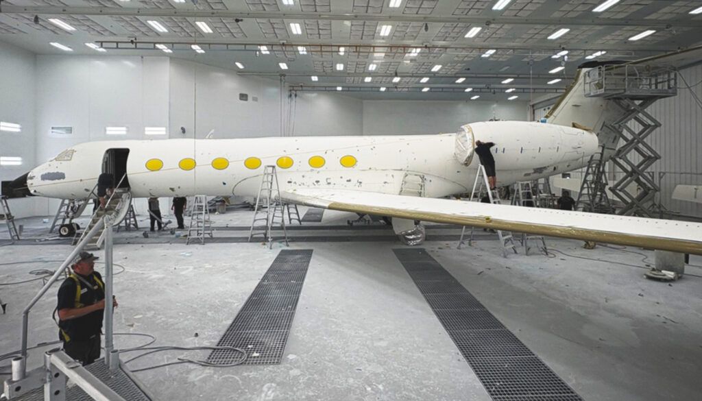 G550 with windows, engines and more masked off ahead of exterior painting