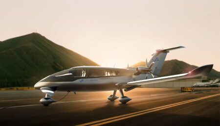 Modern aircraft with "VoltAero" branding on runway