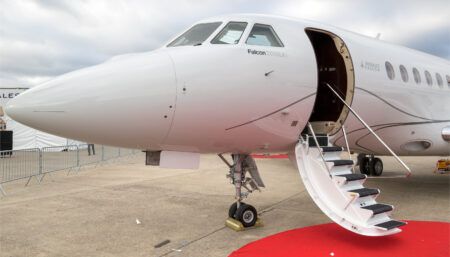 Falcon 2000 business jets to be manufactured in India White Dassault Falcon 2000LX private jet with open door and red carpet on airport tarmac