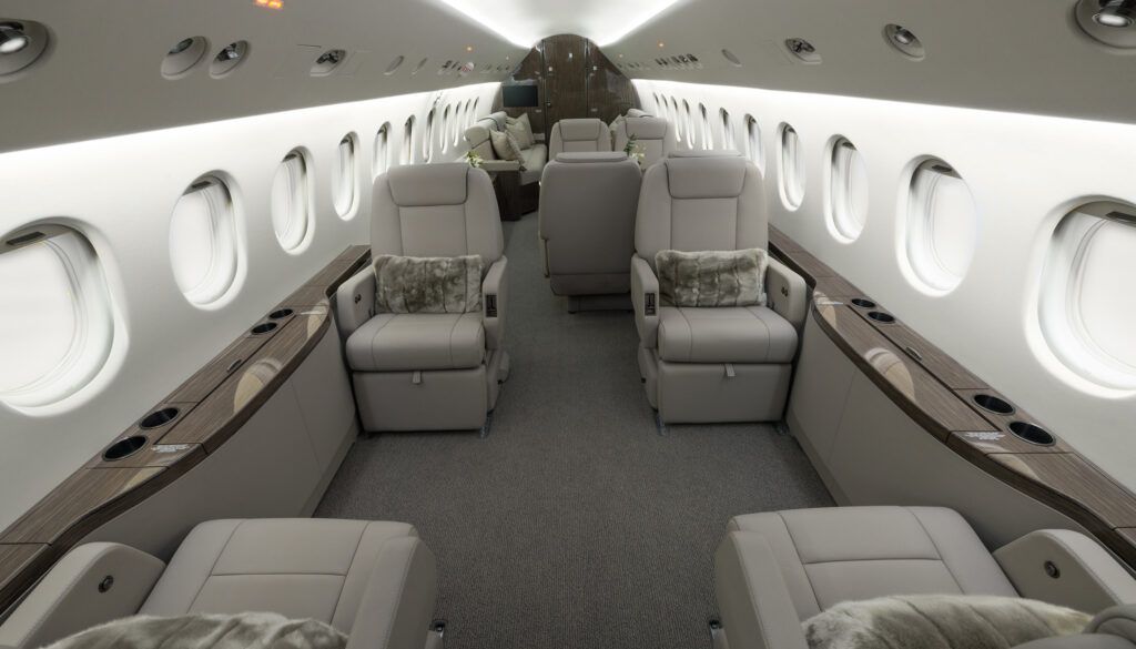 Luxurious private jet interior with beige leather seats