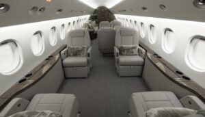 Luxurious private jet interior with beige leather seats and wood accents