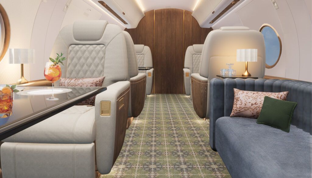 Private jet with cream seating, blue divan and green pattern carpet