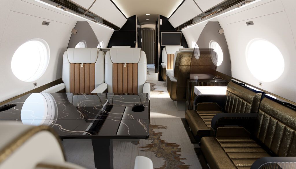Private jet interior featuring cream and brown seats, dining table with topographical design and side-facing seats