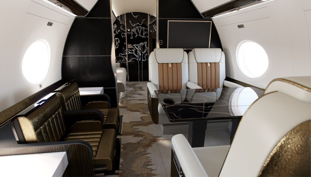 Private jet interior featuring cream and brown seats, table with topographical design, side-facing seats, bulkhead with tree design in background