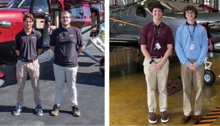 Two pairs of interns in front of aircraft