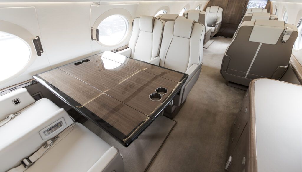 G550 interior with dining table and leather seats