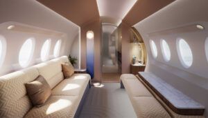 Luxurious private jet interior with light orb feature on bulkhead