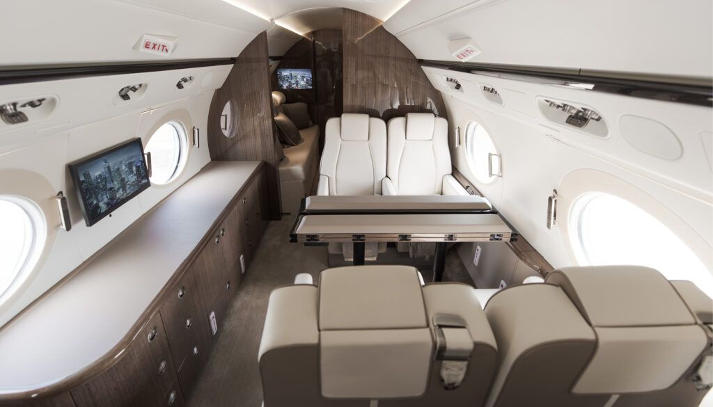 G550 interior with 4-place conference group opposite credenza and monitor