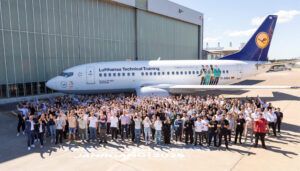 Lufthansa trainees posing with Boeing 737 training aircraft