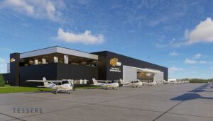Modern aircraft hangar with aircraft parked outside