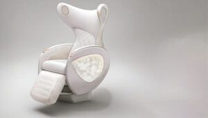 Pale blush VIP chair with curved headrest, quilted upholstery and pearl inlay