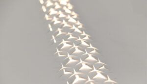 Geometric pattern cut into cream leather with light shining through