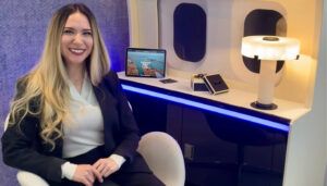 Natalie Rodriguez sat by credenza/sidewall mockup displaying table lamp