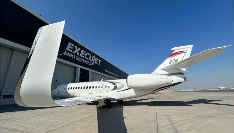 Private jet outside hangar facility