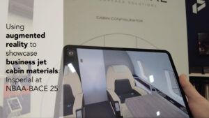 AR image of business jet cabin shown on tablet, corresponding to line drawing of cabin in real life
