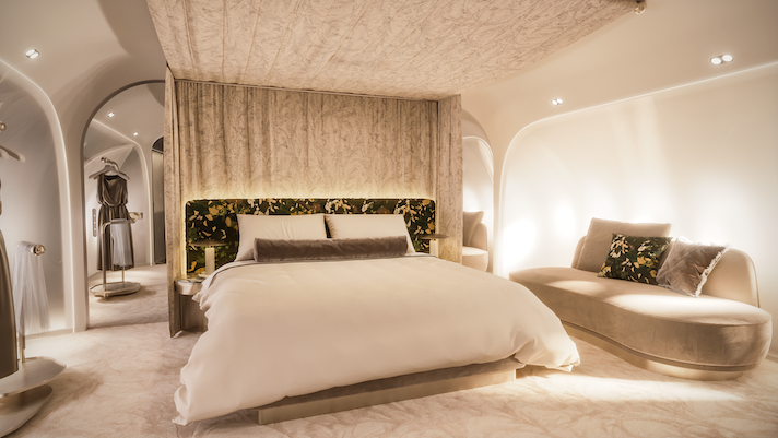 Luxurious bedroom on private jet with large bed