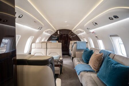 Interior view of Challenger 650 with beige seating and teal accents