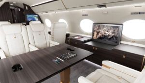 Private jet with white leather seats and pop-up IFE screen