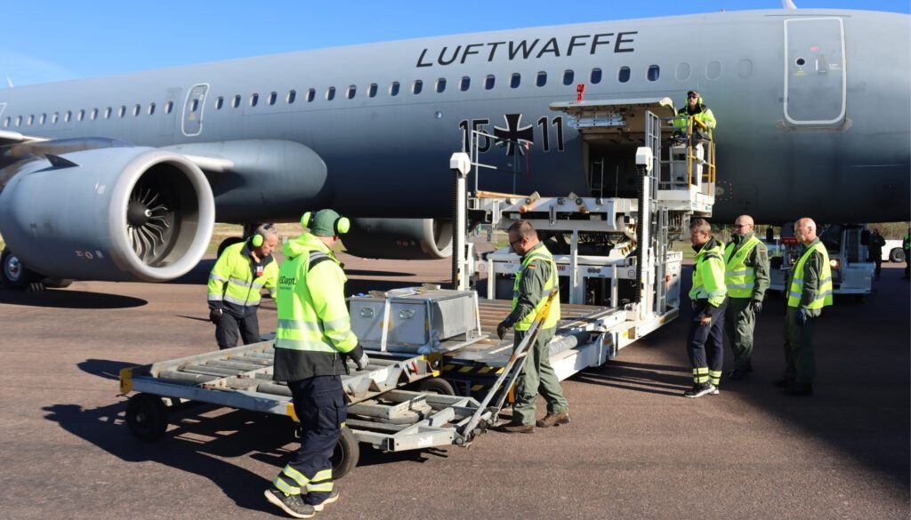 Ground crew loading Luftwaffe transport plane