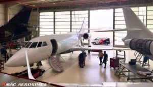 Various aircraft in maintenance hangar